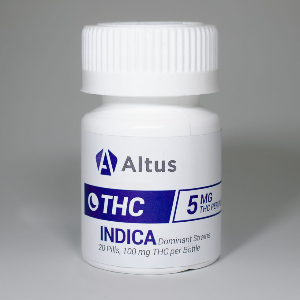 White bottle of Altus THC Indica pills. Cannabis edibles.